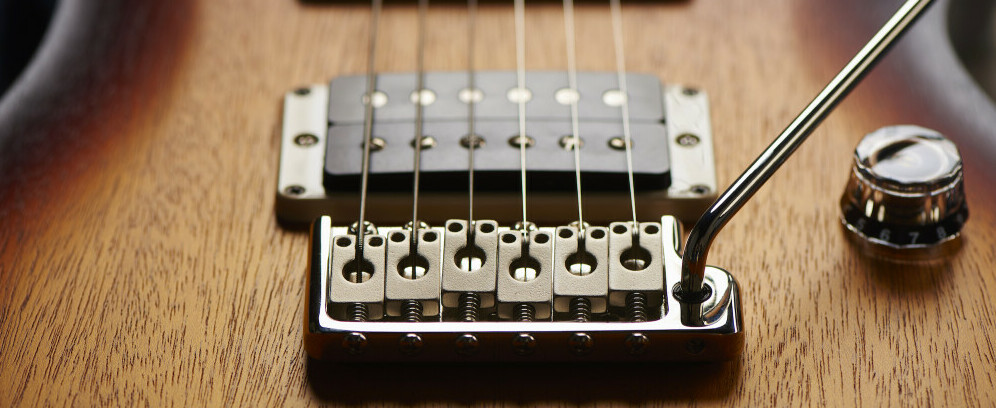 Adjustable bridge - Strung Guitars